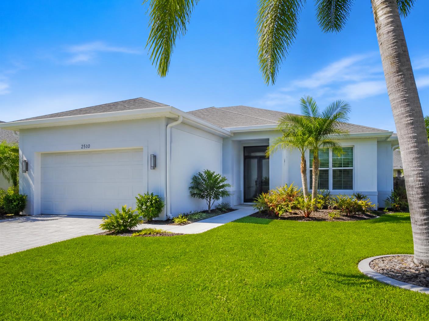 Bright Southwest Florida home with clean white seamless gutters, fascia and soffit